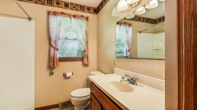 3710 Mcelroy St, Eau Claire, WI 54701 - full bath with a shower, toilet, vanity, and baseboards