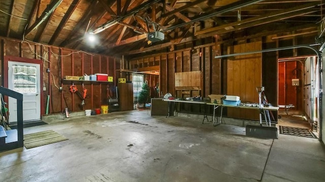3710 Mcelroy St, Eau Claire, WI 54701 - garage featuring a garage door opener and a workshop area