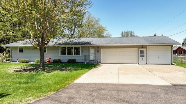 3710 Mcelroy St, Eau Claire, WI 54701 - ranch-style home with a front lawn, a garage, and concrete driveway