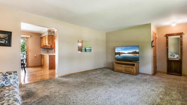 3710 Mcelroy St, Eau Claire, WI 54701 - unfurnished living room featuring carpet flooring and baseboards