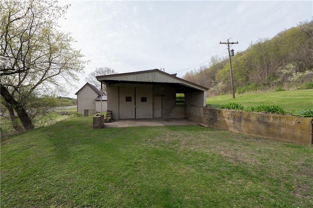 S2232 State Road 35th Hwy, Alma, WI 54610 - back of house featuring a lawn and a patio