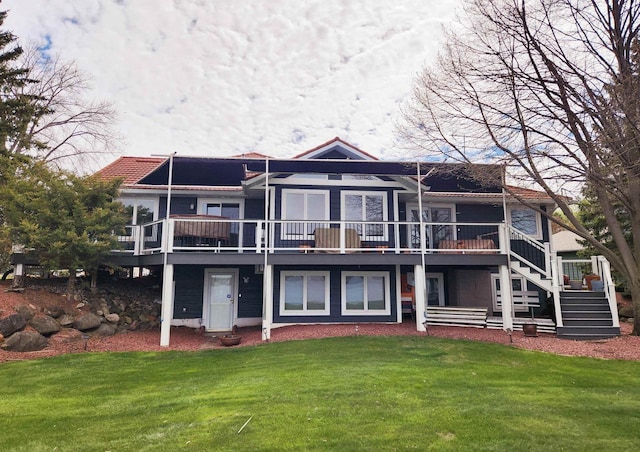 W11055 Eagle Dr, Lodi, WI 53555 - back of house with a lawn, a wooden deck, and stairs