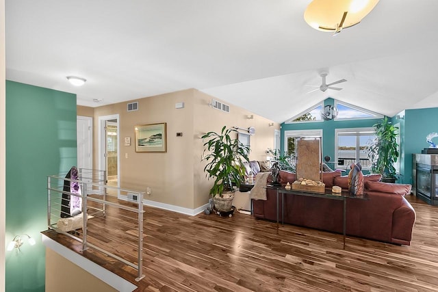 W11055 Eagle Dr, Lodi, WI 53555 - living area featuring wood finished floors, ceiling fan, baseboards, and lofted ceiling