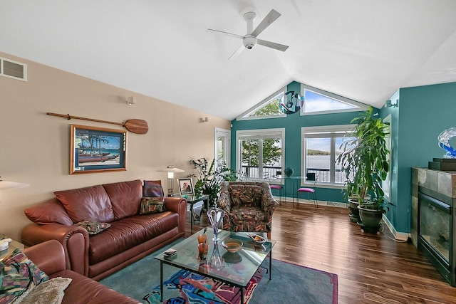 W11055 Eagle Dr, Lodi, WI 53555 - living area featuring a ceiling fan, wood finished floors, vaulted ceiling, a fireplace, and baseboards