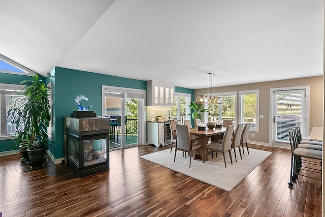 W11055 Eagle Dr, Lodi, WI 53555 - dining room featuring dark wood-style flooring, baseboards, and a chandelier