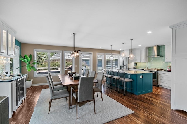 W11055 Eagle Dr, Lodi, WI 53555 - dining area featuring dark wood finished floors, wine cooler, recessed lighting, and baseboards