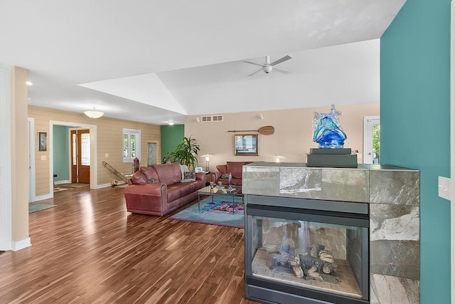 W11055 Eagle Dr, Lodi, WI 53555 - living area with wood finished floors, ceiling fan, baseboards, lofted ceiling, and a tile fireplace