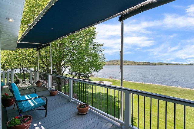 W11055 Eagle Dr, Lodi, WI 53555 - wooden deck featuring a water view and a lawn