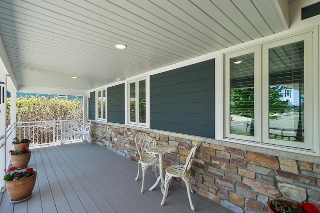 W11055 Eagle Dr, Lodi, WI 53555 - wooden deck with covered porch and french doors