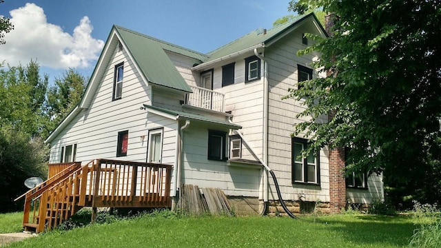 W6593 Drake Rd, Rio, WI 53960 - back of property featuring a balcony and a lawn