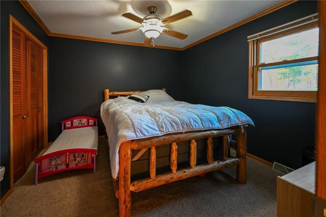 W5937 Ross Rd, Trego, WI 54888 - carpeted bedroom featuring a closet, crown molding, and ceiling fan