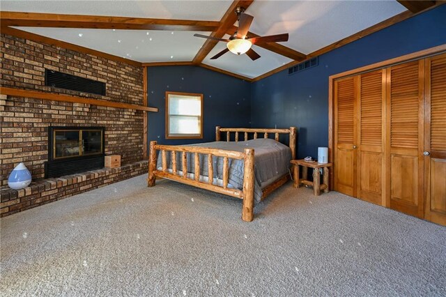 W5937 Ross Rd, Trego, WI 54888 - bedroom with a fireplace, carpet flooring, and a closet