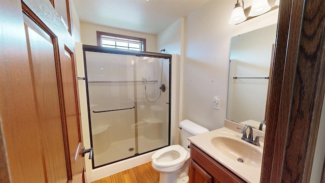 421 John Michael Dr, Jefferson, WI 53549 - full bath featuring a stall shower, wood finished floors, toilet, and vanity