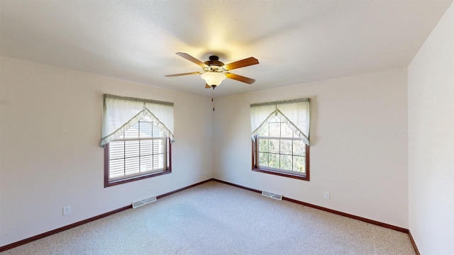 421 John Michael Dr, Jefferson, WI 53549 - carpeted spare room with a ceiling fan and baseboards