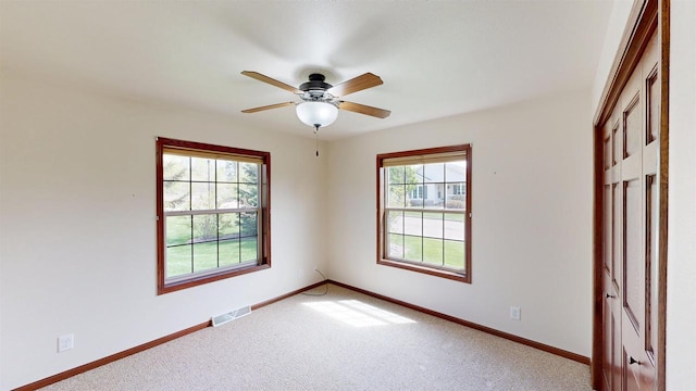 421 John Michael Dr, Jefferson, WI 53549 - carpeted empty room featuring baseboards and ceiling fan