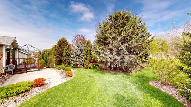 421 John Michael Dr, Jefferson, WI 53549 - view of green lawn featuring a deck, a patio, and a gazebo