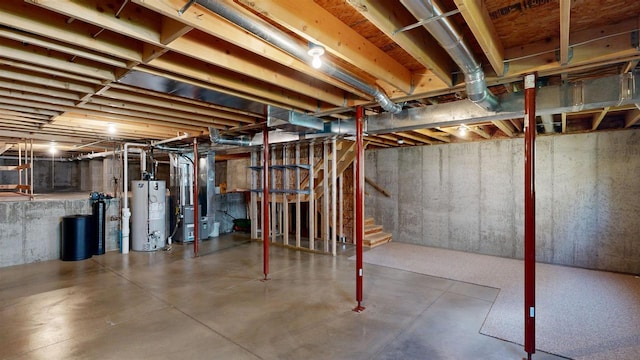 421 John Michael Dr, Jefferson, WI 53549 - unfinished below grade area with water heater, heating unit, stairway, and a water softener system