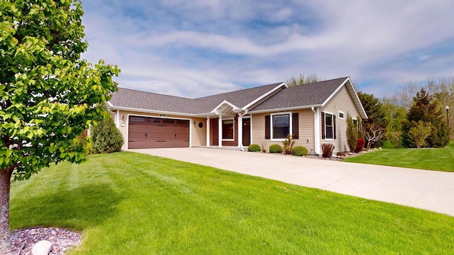 421 John Michael Dr, Jefferson, WI 53549 - ranch-style home featuring a garage, driveway, and a front yard