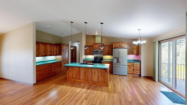 421 John Michael Dr, Jefferson, WI 53549 - kitchen with appliances with stainless steel finishes, light wood-style flooring, a sink, lofted ceiling, and brown cabinets