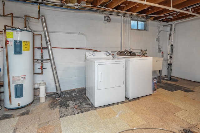 washroom featuring water heater and separate washer and dryer