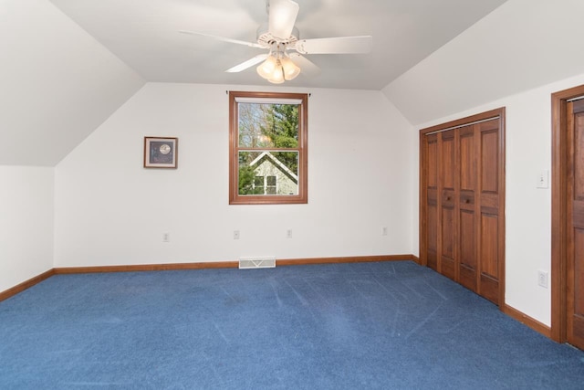 6615 Birchwood Shores Ln, Oconto Falls, WI 54154 - additional living space with lofted ceiling, ceiling fan, carpet floors, and baseboards