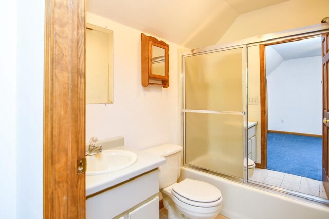 6615 Birchwood Shores Ln, Oconto Falls, WI 54154 - full bathroom with lofted ceiling, vanity, toilet, and combined bath / shower with glass door