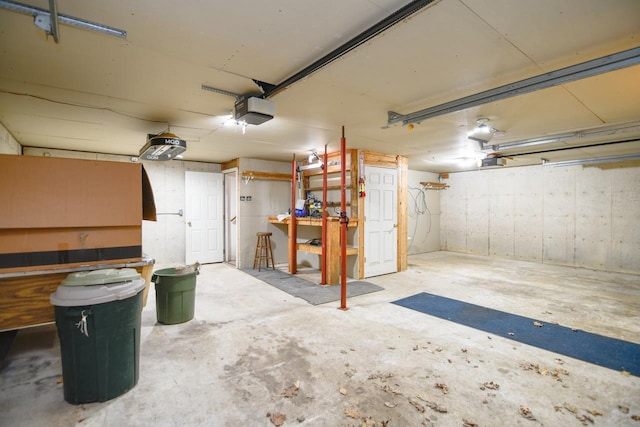 6615 Birchwood Shores Ln, Oconto Falls, WI 54154 - garage with a garage door opener and a workshop area