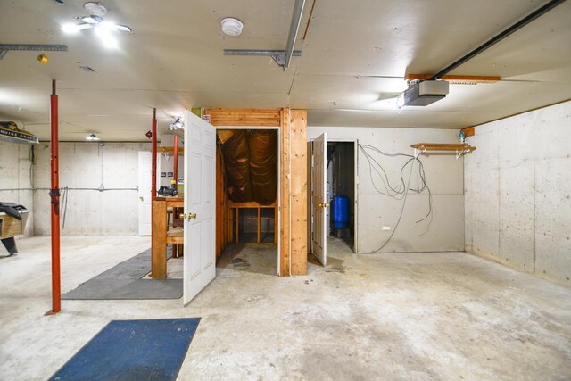 6615 Birchwood Shores Ln, Oconto Falls, WI 54154 - basement featuring a garage and a water pressure tank