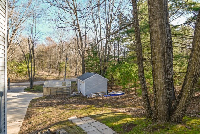 6615 Birchwood Shores Ln, Oconto Falls, WI 54154 - view of yard with an outdoor structure, an exterior structure, and a storage unit