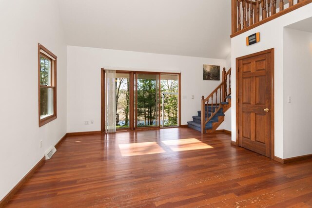 6615 Birchwood Shores Ln, Oconto Falls, WI 54154 - foyer entrance with stairs, wood finished floors, baseboards, and a towering ceiling