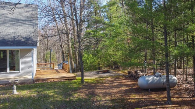 6615 Birchwood Shores Ln, Oconto Falls, WI 54154 - view of yard featuring a wooden deck and a forest view