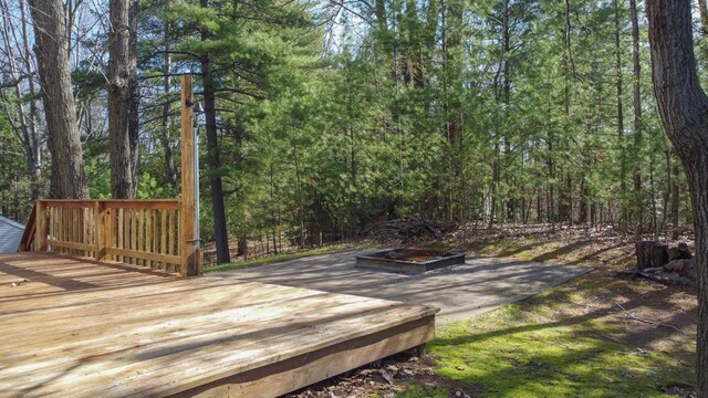 6615 Birchwood Shores Ln, Oconto Falls, WI 54154 - wooden terrace featuring a wooded view