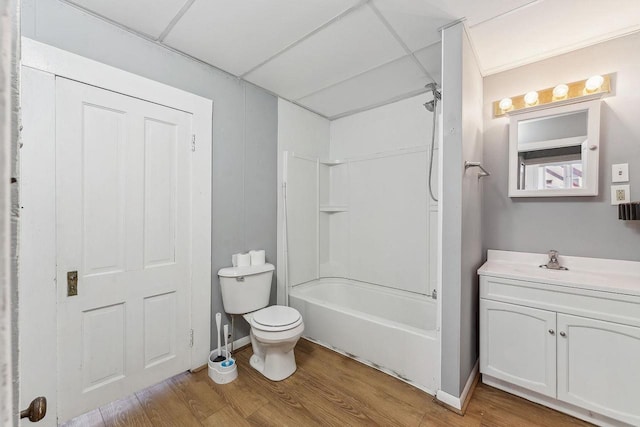 332 La Valle St, Reedsburg, WI 53959 - full bathroom with wood finished floors, toilet, vanity, and shower / tub combination