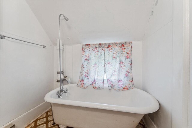 332 La Valle St, Reedsburg, WI 53959 - bathroom featuring a freestanding bath and baseboards