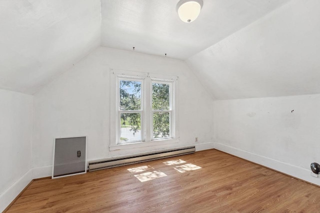 332 La Valle St, Reedsburg, WI 53959 - additional living space featuring baseboard heating, light wood finished floors, lofted ceiling, and baseboards
