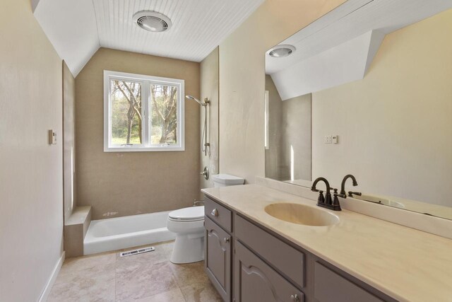 W5685 Koss Rd, Onalaska, WI 54650 - bathroom featuring lofted ceiling, toilet, a shower, and vanity