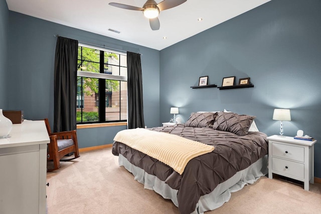 530 W Doty St Unit 105, Madison, WI 53703 - bedroom featuring light carpet, baseboards, and a ceiling fan
