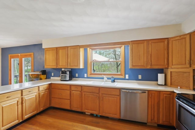 7938 E Hwy 59, Milton, WI 53563 - kitchen with stainless steel appliances, plenty of natural light, a sink, and light countertops