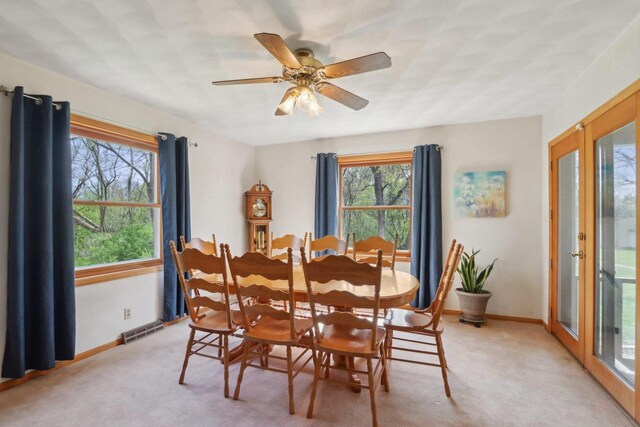 7938 E Hwy 59, Milton, WI 53563 - dining area featuring light carpet, baseboards, and a ceiling fan