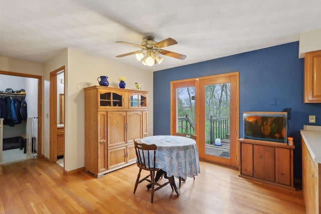7938 E Hwy 59, Milton, WI 53563 - dining space featuring light wood-style flooring, ceiling fan, and baseboards