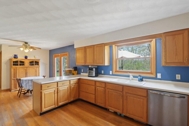 7938 E Hwy 59, Milton, WI 53563 - kitchen with dishwasher, a sink, a peninsula, and plenty of natural light