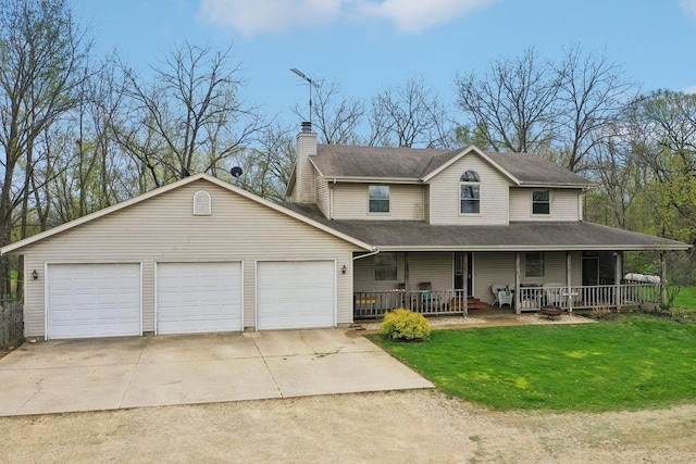 7938 E Hwy 59, Milton, WI 53563 - view of front of home with covered porch, a front yard, a chimney, an attached garage, and concrete driveway