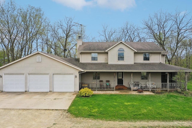 7938 E Hwy 59, Milton, WI 53563 - view of front facade with covered porch, a front yard, a chimney, concrete driveway, and a garage