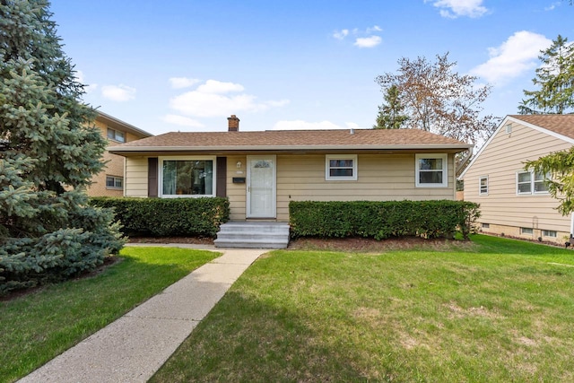 9517 W Capitol Dr, Milwaukee, WI 53222 - view of front facade with a chimney and a front lawn