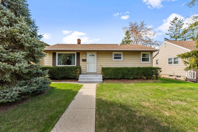 9517 W Capitol Dr, Milwaukee, WI 53222 - view of front facade featuring a front yard, a chimney, and cooling unit