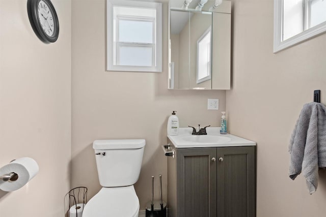 657 Elm St, Black River Falls, WI 54615 - bathroom with healthy amount of natural light, toilet, and vanity