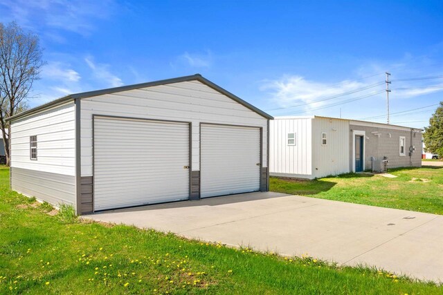 657 Elm St, Black River Falls, WI 54615 - detached garage featuring central AC unit