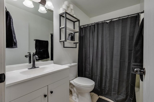 bathroom featuring toilet, tile patterned flooring, vanity, and a shower with curtain