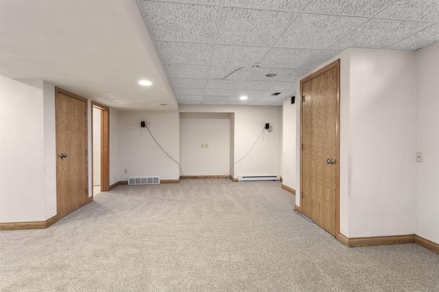 37 Pheasant Ct, Appleton, WI 54915 - finished below grade area with light carpet, baseboard heating, baseboards, recessed lighting, and a drop ceiling