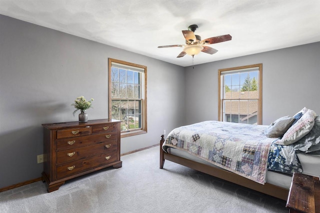 37 Pheasant Ct, Appleton, WI 54915 - bedroom with baseboards, light carpet, and a ceiling fan
